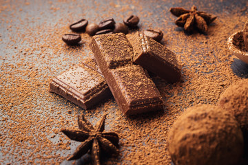 Chocolate truffle,Truffle chocolate candies with cocoa powder.Homemade fresh energy balls with chocolate.Gourmet assorted truffles made by chocolatier.Chunks of chocolate and coffee beans