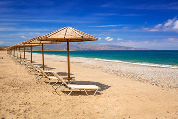 Tropical parasols at Maleme beach on Crete, Greece