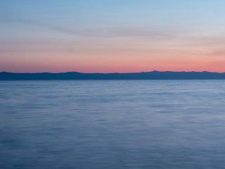 Fototapeta premium Blue sea at sunset long exposure