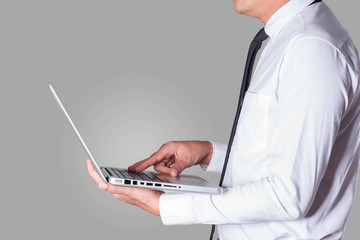 business man holding a laptop working.