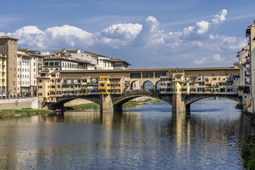 Fototapeta na wymiar Superb view of the famous Ponte Vecchio bridge from Ponte Santa Trinita, against a picturesque sky, historic center of Florence, Italy