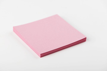 Fototapeta premium Notebook with pink leaves on white background.