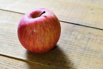 An apple on the wooden box