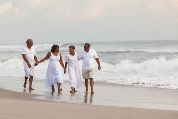 Happy Senior African American Couples Men Women on Beach