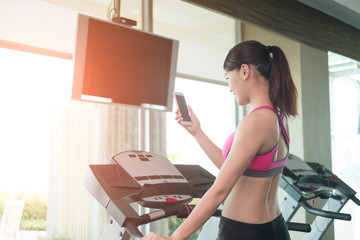 woman stand on treadmill