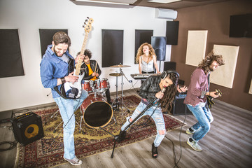Rock band playing in a recording studio