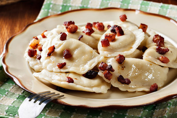 Dumplings with meat or cabbage and mushroom or cheese seasoned fried bacon