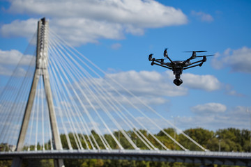 Drone for industrial works flying in sky.