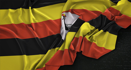 Uganda Flag Wrinkled On Dark Background 3D Render