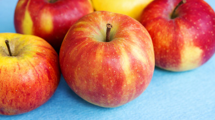 Fototapeta na wymiar closeup of apples on a blue background