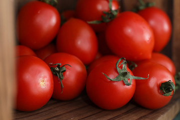 Fresh bright and juicy tomatoes on the kitchen