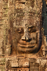 Fototapeta na wymiar Giant stone face at Bayon Temple in Cambodia
