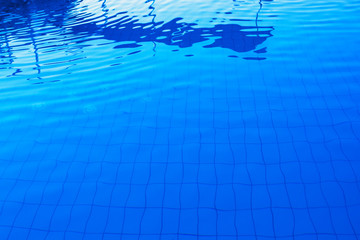 Blue outdoor poolside water surface as abstract background