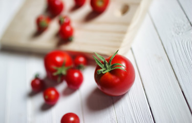 Naklejka na ściany i meble harvest fresh tomato top on wooden background