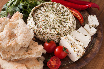 Homemade indian soft cheese paneer with herbs