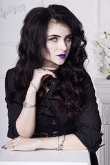 Fototapeta premium Sensual gothic woman in a long gorgeous black dress