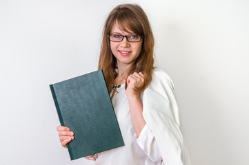Happy graduate woman with her dissertation work on white
