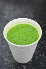 Hot matcha  greentea latte on white paper glass