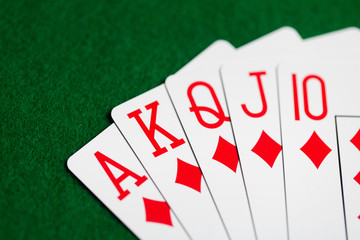 poker hand of playing cards on green casino cloth