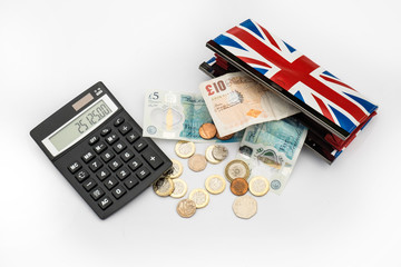 British money with purse and calculator