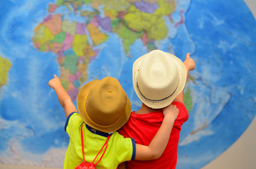 Adventure and travel concept. Happy kids are dreaming about travel, vacation.