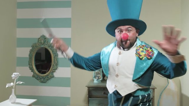 Magician in blue suit and hat manipulates waving a magic wand 4k