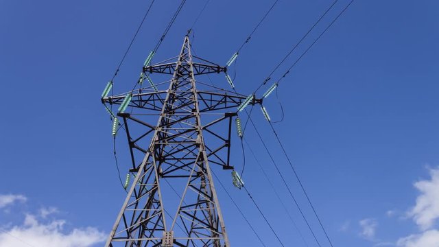 High-voltage wires on an electrical support. Electric power industry - timelapse