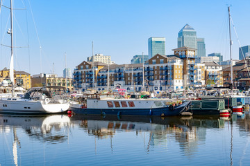 Fototapeta na wymiar Boats and yachts moored at Limehouse Basin Marina in London