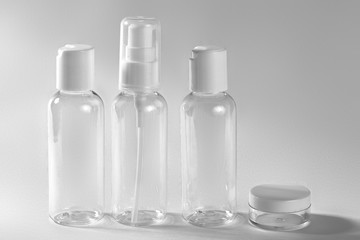 White cosmetic bottles on white background. Wellness, spa and body care bottles collection. Beauty treatment