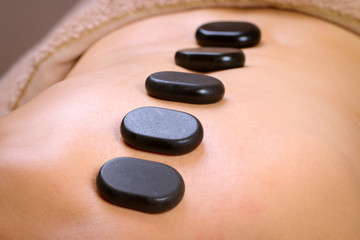 Obraz na płótnie Canvas Massage therapist massaging shoulders and back of a male