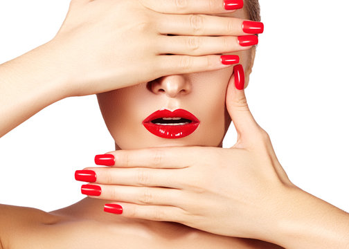 Red lips and bright manicured nails. Sexy open mouth. Beautiful manicure and makeup. Celebrate make up and clean skin