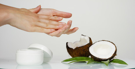 Fresh nourishing coconut milk moisturizing cream for hands, face and skin isolated on a white background, concept: spa, skincare, beauty, healthy lifestyle, bio products, ecologic products, massage.