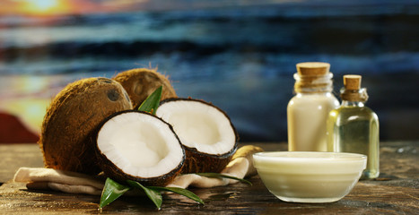 Fresh nourishing coconut milk moisturizing cream for hands, face and skin, on the background of the...