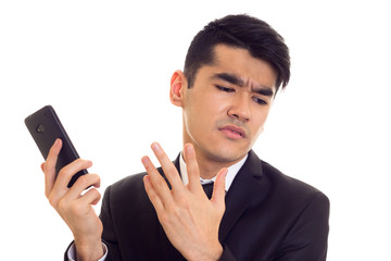 Young man in suit talking on the phone