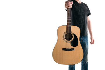 Guitarist in jeans and a black T-shirt, stretches an acoustic guitar, on the right side of the frame, on a white background. Play it!Horizontal frame