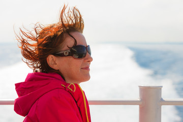 Tourist woman on liner seascape background