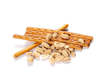 salty cracker pretzel sticks and peanuts isolated on white background, texture