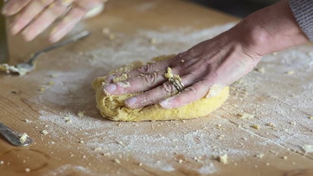 close up on Hands of woman knead the dough