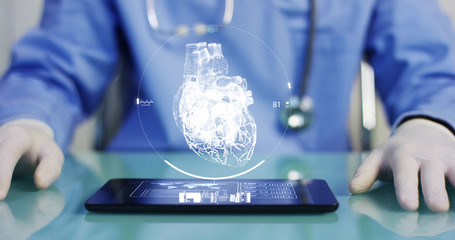 A physician, surgeon, examines a technological digital holographic plate represented the patient's...