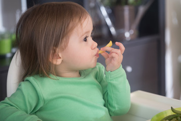 Tasty pomfrit.Cute little girl tasting pomfrit