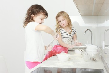happy family funny kids are preparing the dough, bake cookies in the kitchen