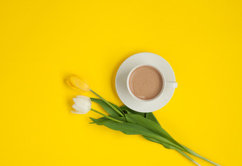 Two different tulips and coffee cup