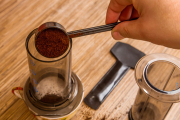 Preparation of ground coffee in aeropress - portable filter coffee maker