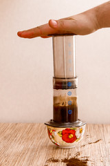 Preparation of ground coffee in aeropress - portable filter coffee maker