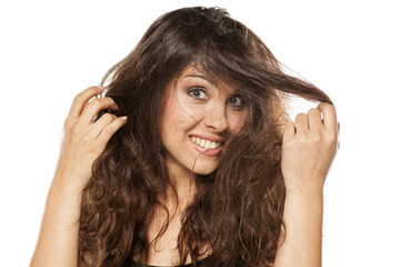 Fototapeta premium A young happy woman with a messy long hair