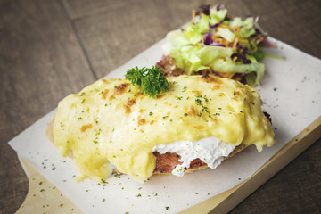 Cheese bread and salad on board