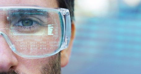 A man with a futuristic look with glasses augmented reality in holography.	
