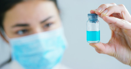 woman hand of a hospital medical expert shows the pill to be taken by patient in slow motion.	