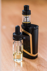 Vaping electronic mech mod and vape liquid.