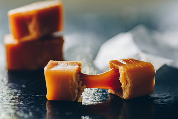 Caramel fudges on dark background